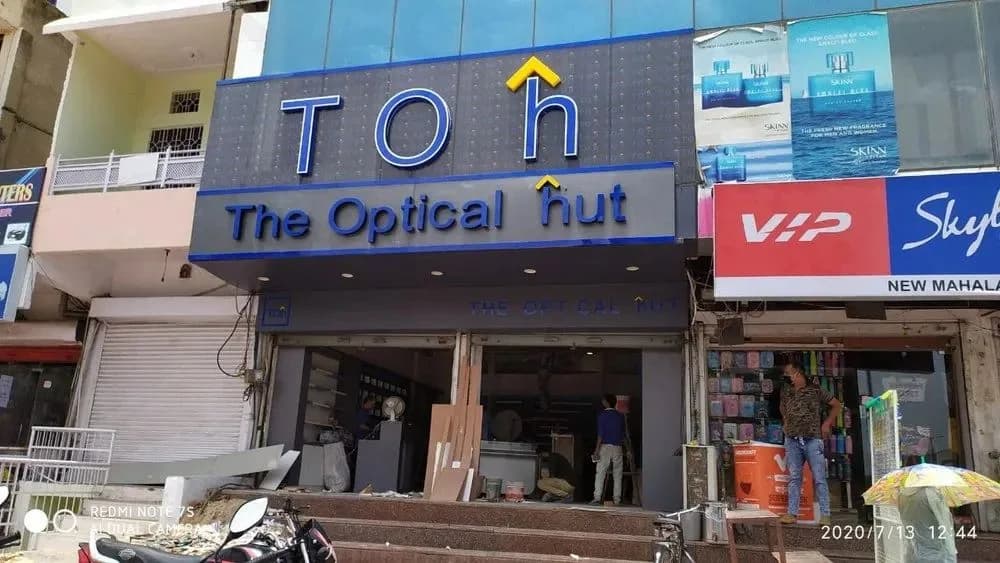 Shopfront with ACP cladding, backlit fascia lettering and printed side panels, signage work by iMad, Jaipur