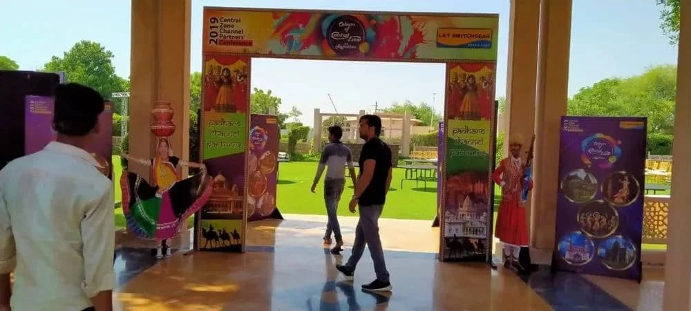 Branded entrance arch and standees at an event venue, promotional branding by iMad, Jaipur