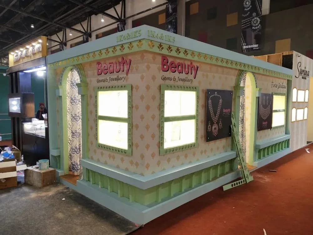 Fabricated exhibition stall with illuminated window panels and decorative arches, retail branding by iMad, Jaipur