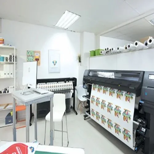 Large-format printer producing printed banners in a studio, printing work by iMad, Jaipur