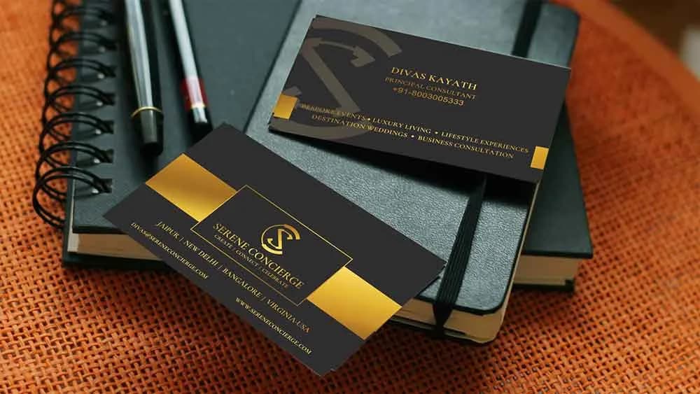 Dark business cards with a gold Serene Concierge logo, logo design concept by iMad