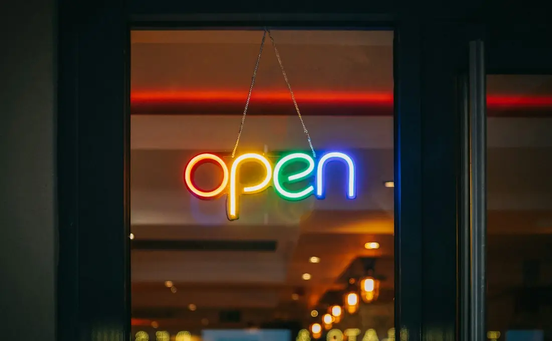 Colourful LED neon open sign hanging in a shop window