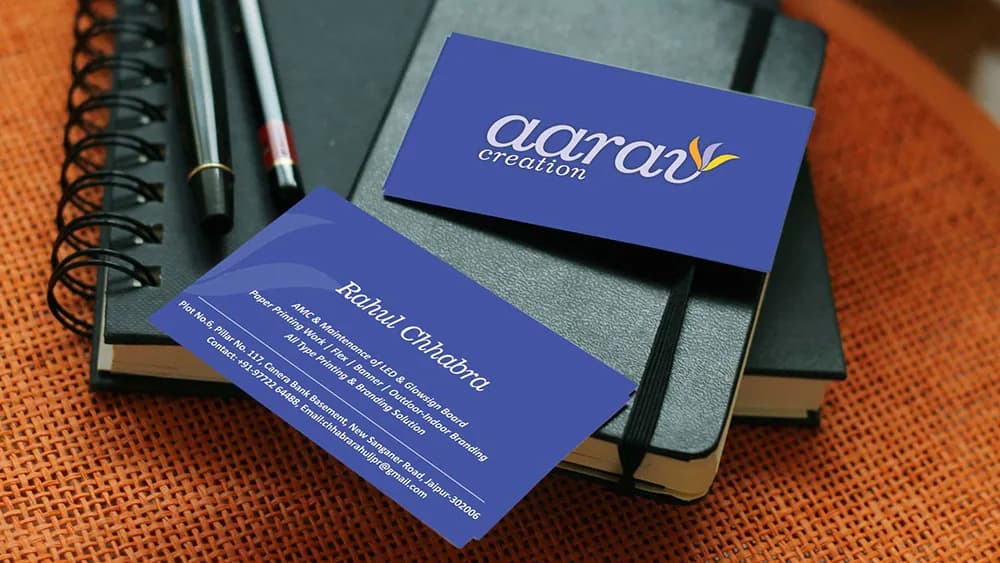 Blue business cards carrying the Aarav Creation logo, logo design concept by iMad