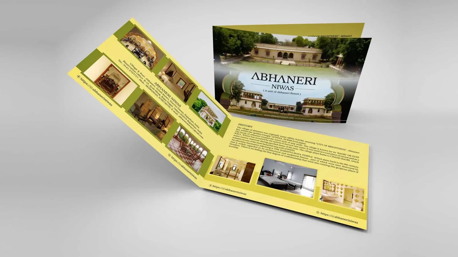 Folded Abhaneri Niwas brochure with property photographs on a yellow interior, brochure design concept by iMad