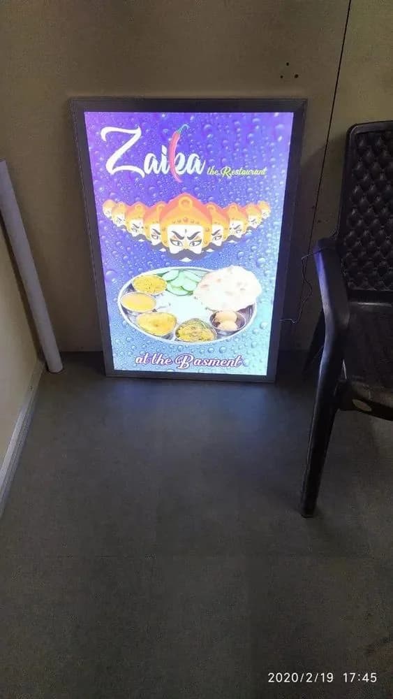 Illuminated clip-on light box showing a printed food advertisement, signage work by iMad, Jaipur