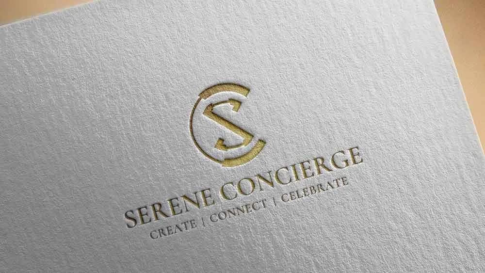 Serene Concierge logo in gold with the line Create, Connect, Celebrate, embossed on textured paper, logo design concept by iMad